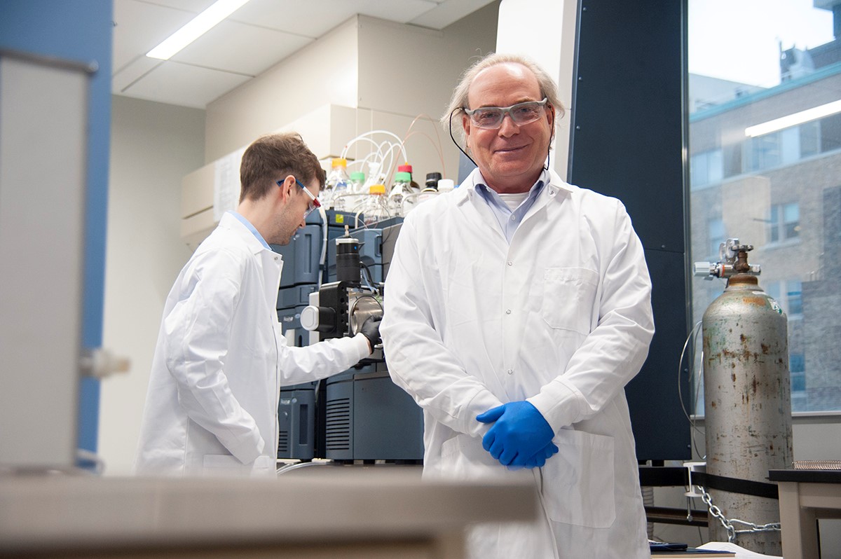 Yoav Finer and Cameron Stewart in a lab