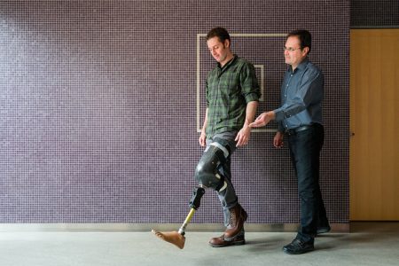 Jan Andrysek with patient testing out a prosthetic leg