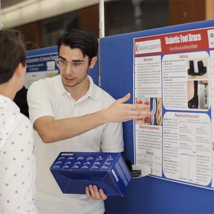 Student presenting at a conference